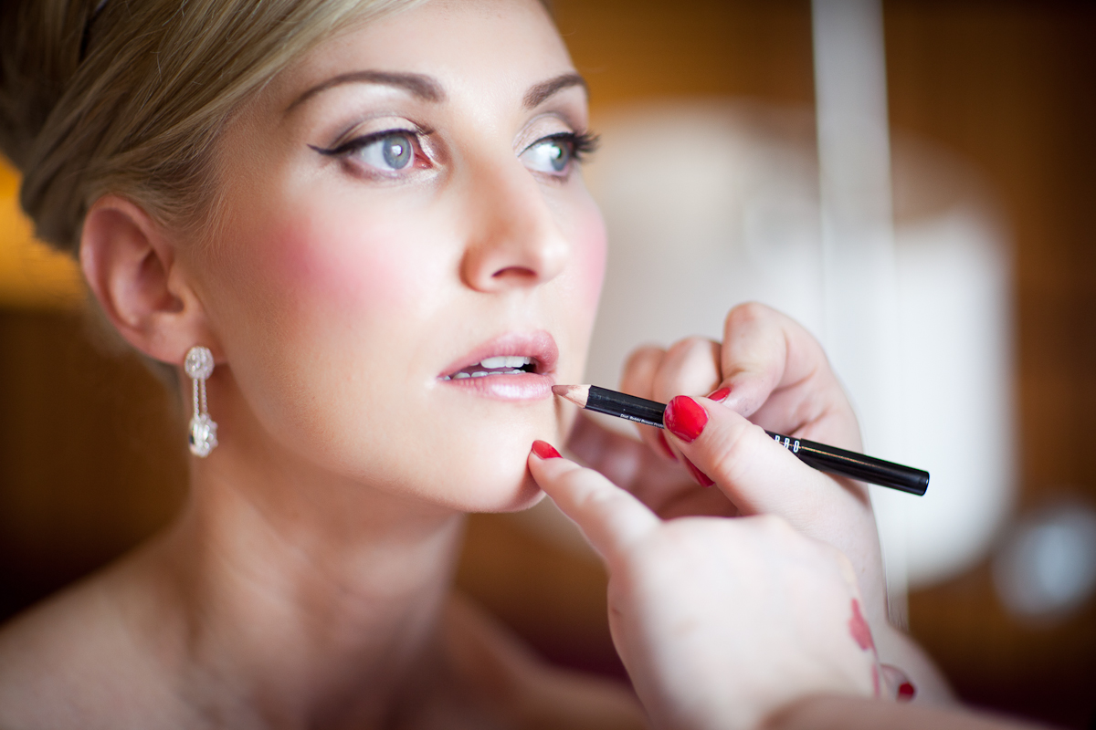 bride getting make up done artist